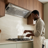Home cook using the Kaiser stainless steel cooker hood