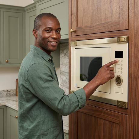 Home cook using the microwave’s electronic buttons