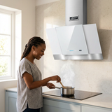 Home cook using the white Kaiser Grand Chef hood in a bright kitchen
