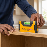 Installer checking an oak shelf with the Ingco magnetic hand level