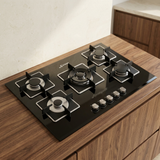 Kaiser 77cm black gas hob installed in a walnut countertop