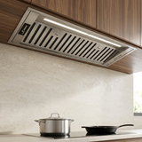 Kaiser stainless steel cooker hood integrated beneath walnut cabinetry