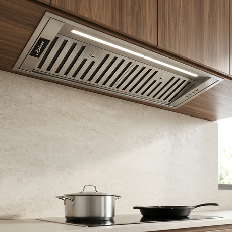 Kaiser stainless steel cooker hood integrated beneath walnut cabinetry