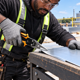 Roofer using Coofix aviation snips from the edge of a metal sheet