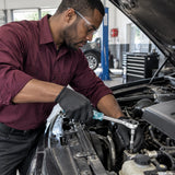 African American mechanic using a JcTop 1/2-inch reversible ratchet on a confined engine-bay fastener