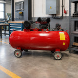 Mirage 300L red air compressor parked beside an organised fabrication workshop service area.