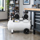 Mirage MY5002-50 50L air compressor parked beside a workbench in an organised professional airbrush studio