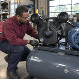 Technician installing a Mirage MY2105VWT twin-head compressor pump onto a compatible belt-driven compressor assembly