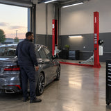 Serviced passenger vehicle ready for handover beside an unused Mirage PL-4.0-2D workshop lift