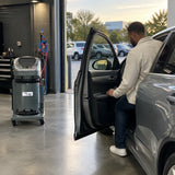 Serviced passenger vehicle ready for handover beside the Mirage AC756UC-10 R134a air-conditioning service station.