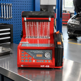 Mirage HP-6B injector cleaning and testing machine resting on a service bench in a clean automotive diagnostics workshop.