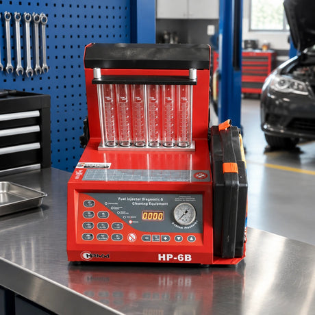 Mirage HP-6B injector cleaning and testing machine resting on a service bench in a clean automotive diagnostics workshop.