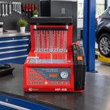 Mirage injector cleaning and testing machine resting on a professional automotive diagnostic bench.