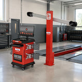 Mirage U-VA2023D-PRO wheel alignment system parked beside an empty alignment lift in a clean professional workshop.