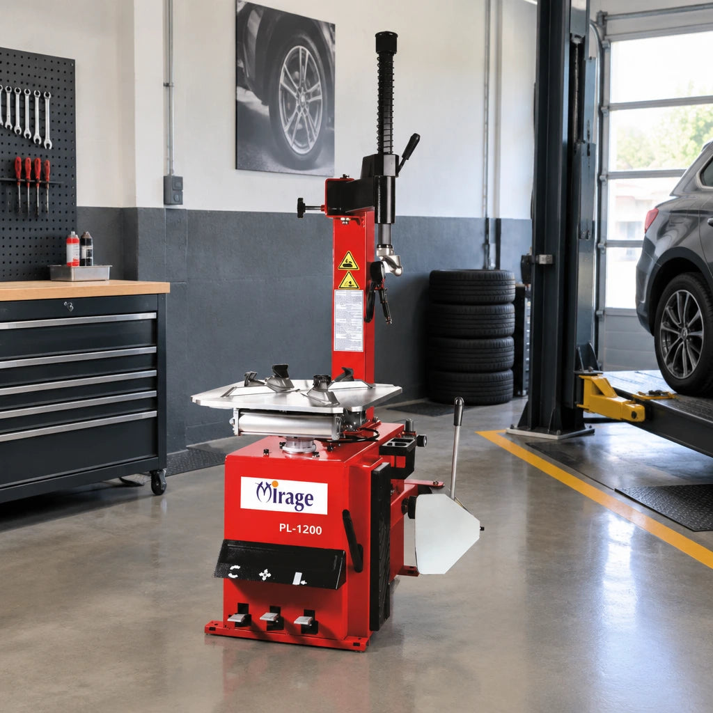 Mirage PL-1200 tyre changer parked in a clean independent tyre shop service bay