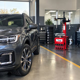 Serviced SUV ready for handover beside the Mirage PL-1292IT tyre changer.