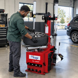 Technician using the Mirage PL-1292IT helper arm to service a low-profile SUV wheel.