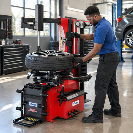 African American tyre technician using the Mirage U-639 to service a compatible SUV wheel in a clean workshop.