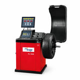 Mirage PL-1828 computerised wheel balancer with mounted tyre, digital display and protective hood on white background