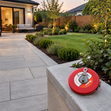 Completed courtyard planting layout with the closed red Mister 20m measuring tape resting beside the finished border.