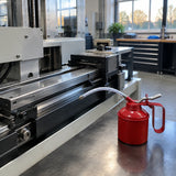 Serviced machine slide and linkage ready for operation with the Mister red hand oil can resting nearby