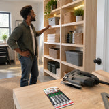Completed timber utility-room shelving with an inactive compatible jigsaw and NRG T144D blade pack nearby.