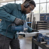 African American metal-fabrication technician guiding a compatible jigsaw with an NRG T318A blade through supported metal profile