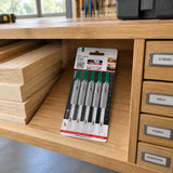 Packaged NRG T344D wood jigsaw blades resting in an organised professional carpentry workshop storage shelf