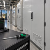 Completed plant-room service cover with a Wera 334 slotted screwdriver resting on the maintenance bench.