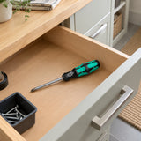 Wera Phillips screwdriver resting in an organised home utility-room maintenance drawer.