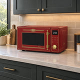 Bordeaux Red Kaiser Empire freestanding microwave resting on a refined contemporary kitchen countertop