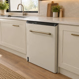 Ivory and black Kaiser Empire semi-integrated dishwasher installed beneath the counter in a contemporary kitchen.