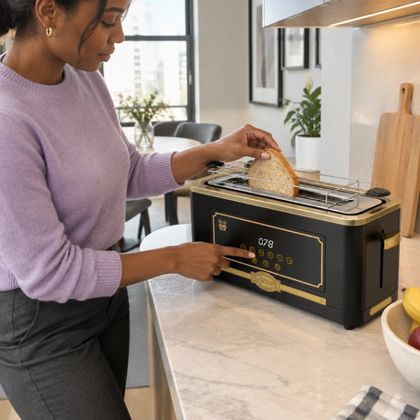 African American adult using a black Kaiser Empire electric toaster to prepare toast at a contemporary breakfast counter.