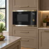 Black Kaiser Art Deco built-in microwave installed in a refined contemporary kitchen appliance tower.