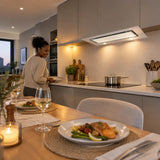 Finished supper beside a settled cooktop with the Kaiser white glass cooker hood visible in a refined open-plan kitchen.