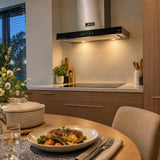 Settled contemporary kitchen with ready meal and Kaiser AT 6433 Eco chimney hood visible after cooking