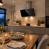 Fresh orderly kitchen and dining area with the Kaiser black glass cooker hood visible after cooking