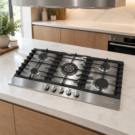 Kaiser stainless steel five-burner gas hob installed in a refined contemporary kitchen island