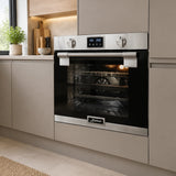 Kaiser EH 6337 built-in electric oven installed in a refined contemporary apartment kitchen.