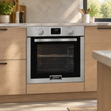 Kaiser 79L stainless steel electric oven installed in a refined contemporary residential kitchen beneath a worktop.