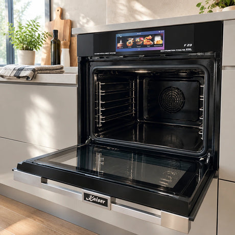 Clean Kaiser EH 6344 pyrolytic oven interior open and ready in a contemporary kitchen