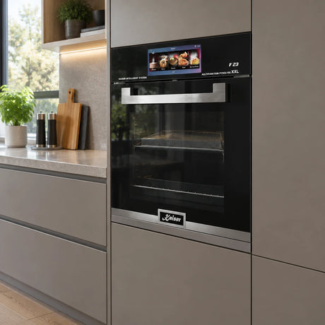 Kaiser EH 6344 black built-in electric oven installed in a contemporary kitchen cabinet wall