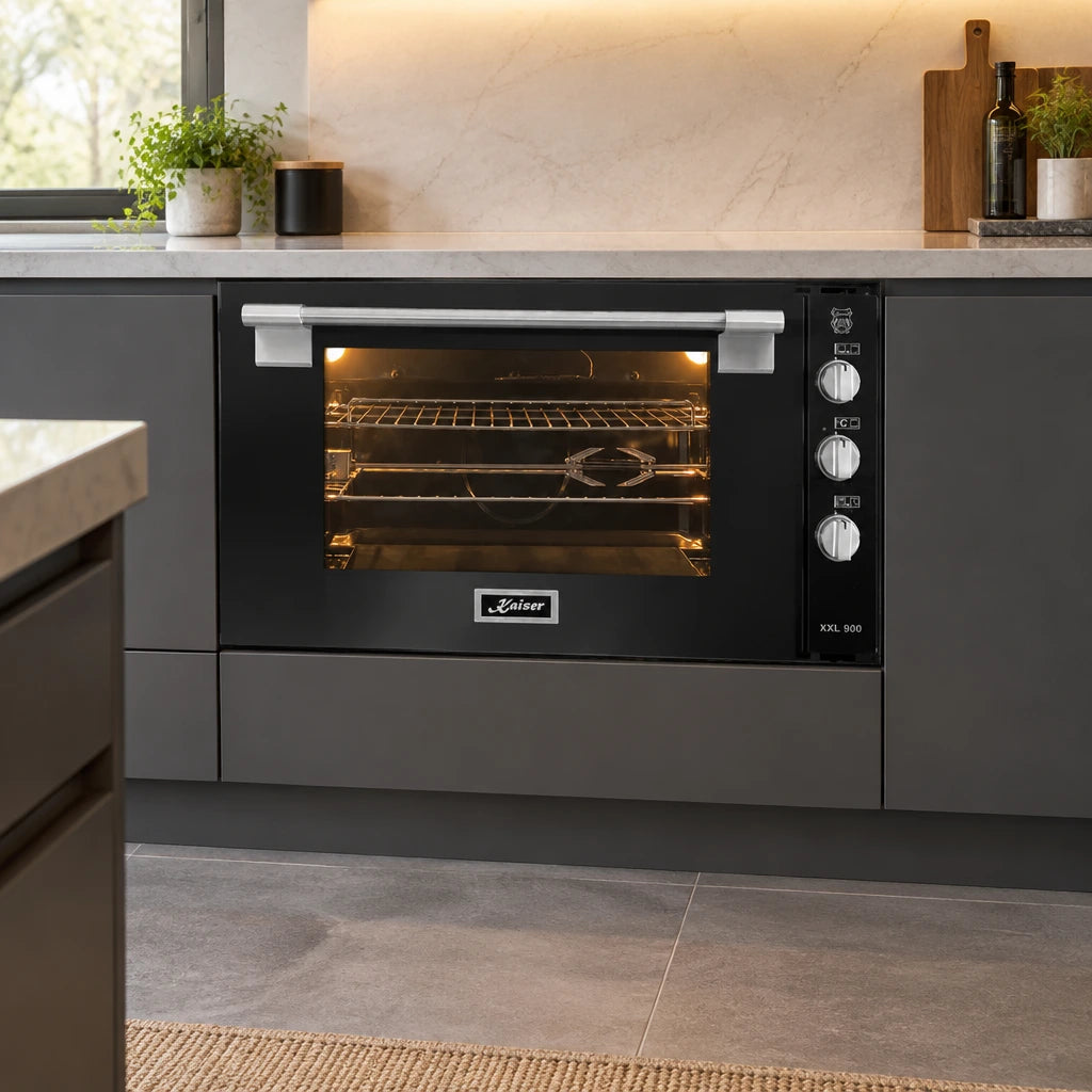 Kaiser 105L black built-in gas oven installed in a contemporary 90cm kitchen cabinet run.