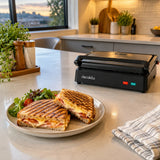 Toasted sandwiches served beside the closed Decakila two-slice contact grill in a modern kitchen.