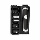 Decakila KMHR017W black-and-silver 5-in-1 rechargeable grooming kit with interchangeable heads, guide combs, and cleaning brush in its storage tray.