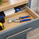 Wadfow pump pliers resting in an organised utility-room maintenance drawer.