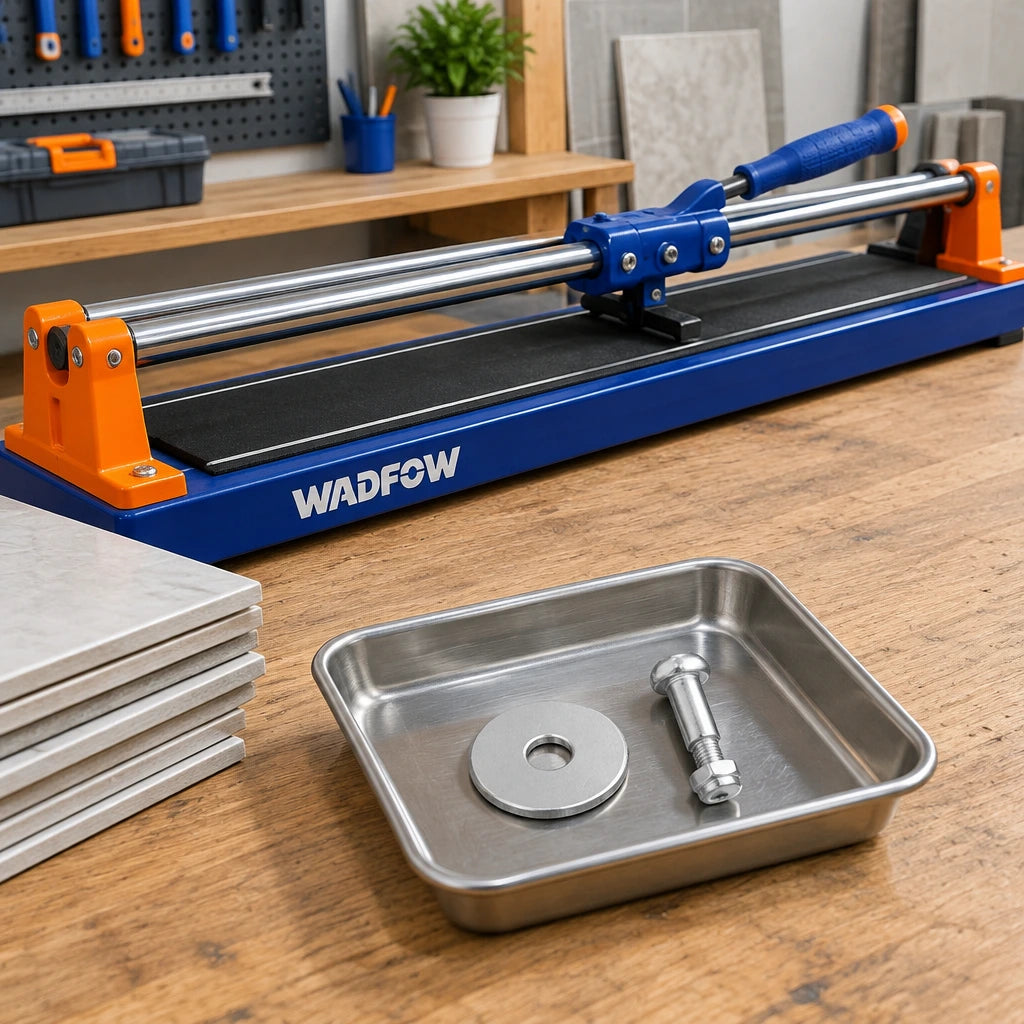Wadfow tile cutter replacement scoring wheel and bolt resting beside a stored manual tile cutter in an organised workshop
