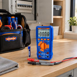 Wadfow WDM2502 multimeter resting with its test probes in an electrician’s service tote in a utility room