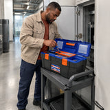African American facilities technician retrieving a hand tool from an open Wadfow WTB1319 toolbox beside a commercial service cabinet