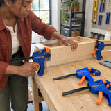African American DIY maker using Wadfow quick bar clamps to hold a small timber frame during glue-up